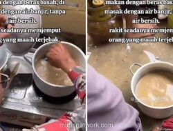 Korban Aceh Terpaksa Masak Nasi dengan Air Banjir